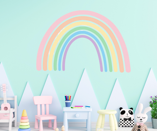 Colorful rainbow wall sticker in a cozy kids' room with soft pastel decor, perfect for nursery or toddler spaces.