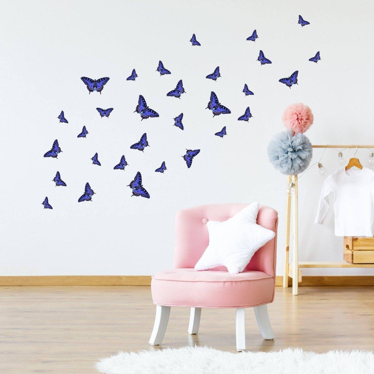 30 decorative butterfly wall stickers in purple flying across a bright room with a pink chair and soft decor.