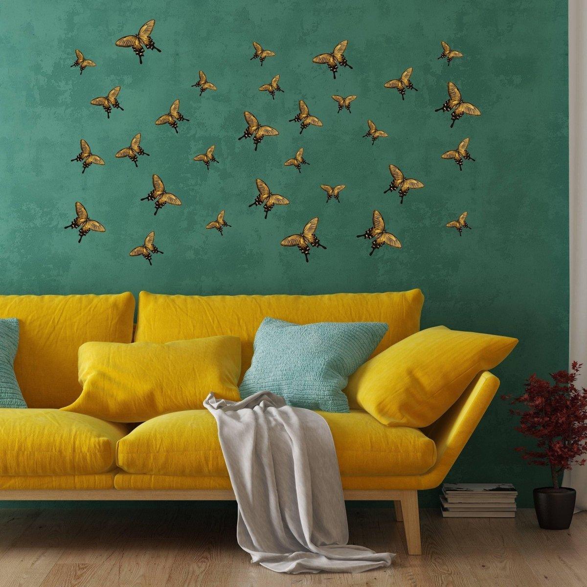 Colorful butterfly wall decor stickers flying above a yellow sofa in a cozy living room setting.