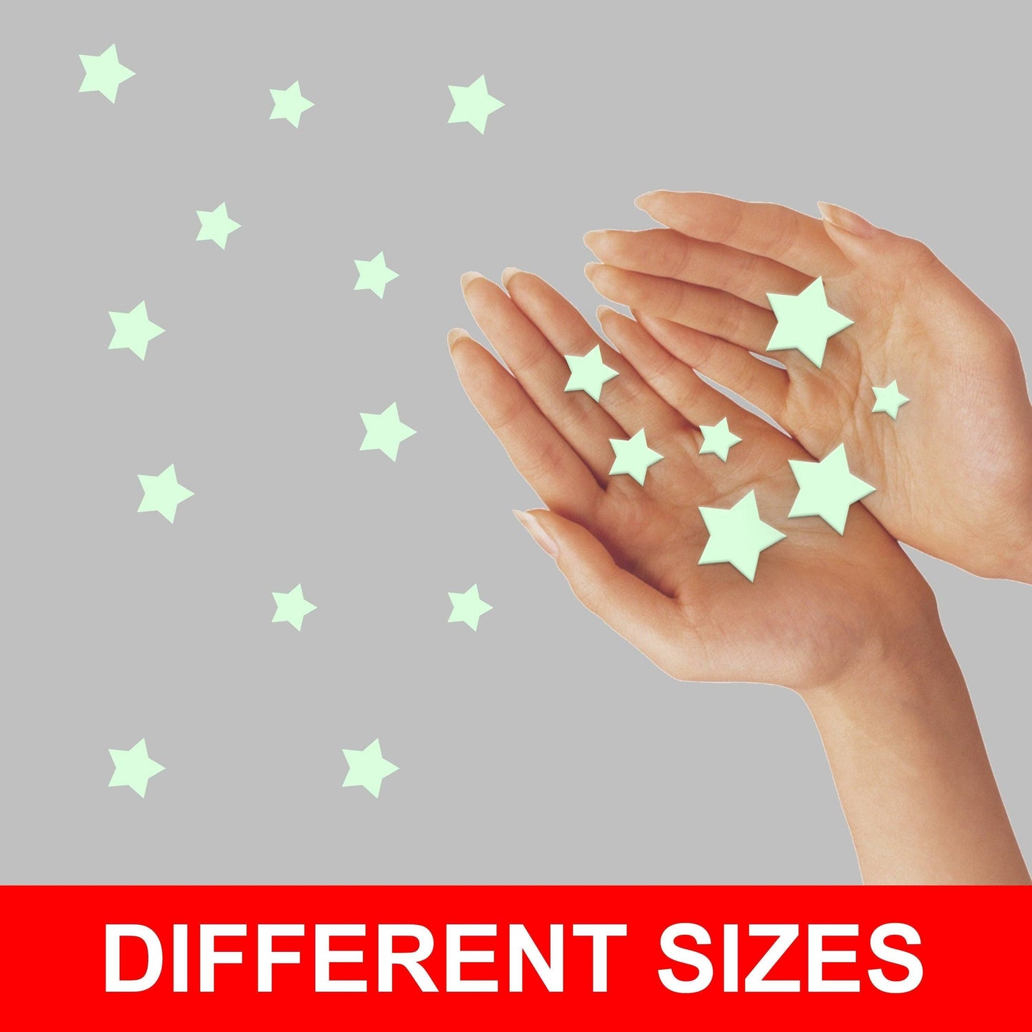 Hands holding glow in the dark stars in different sizes for decorating children's rooms.