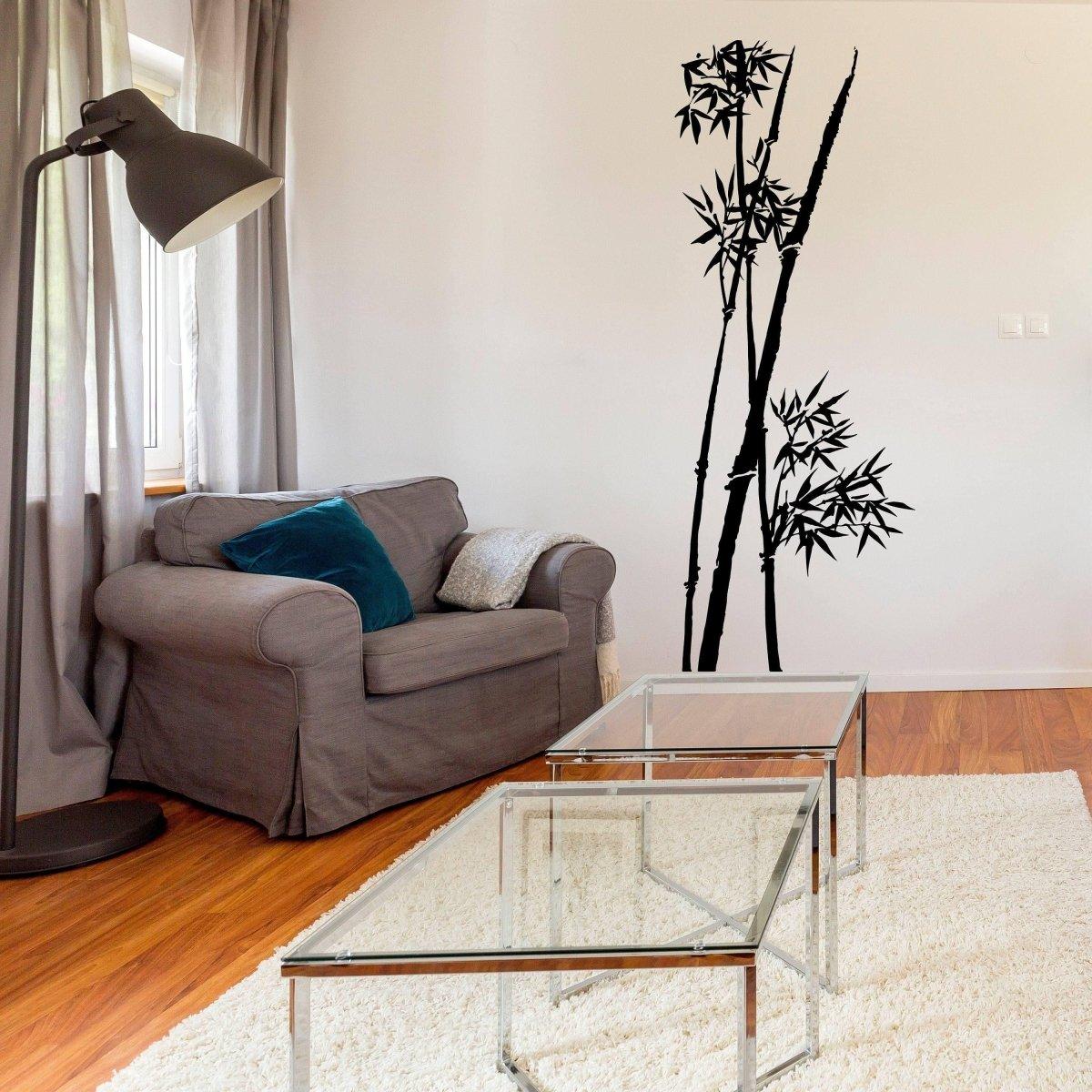 Bamboo wall art decal in a modern living room, featuring a stylish couch and glass coffee table.