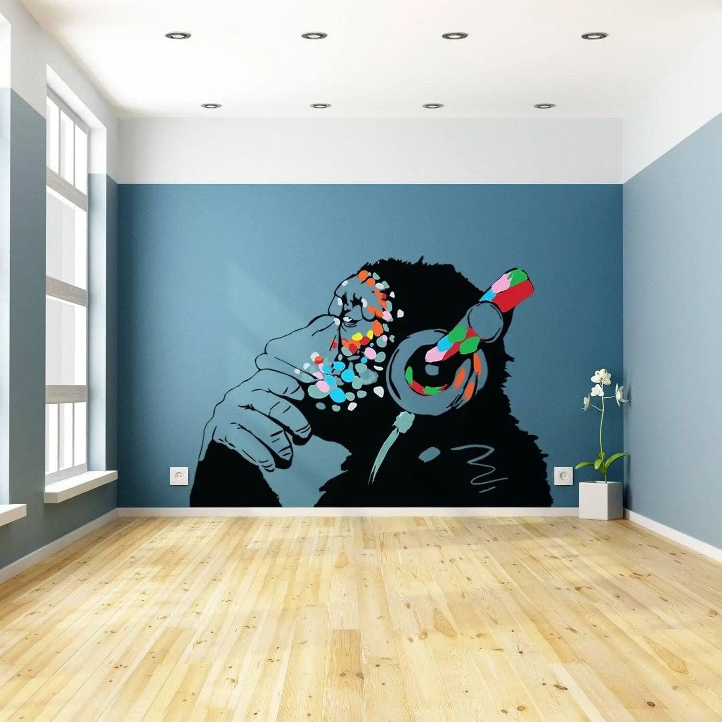 Banksy-inspired thinking monkey wall sticker in a modern interior with headphones, bright colors, and artistic flair.