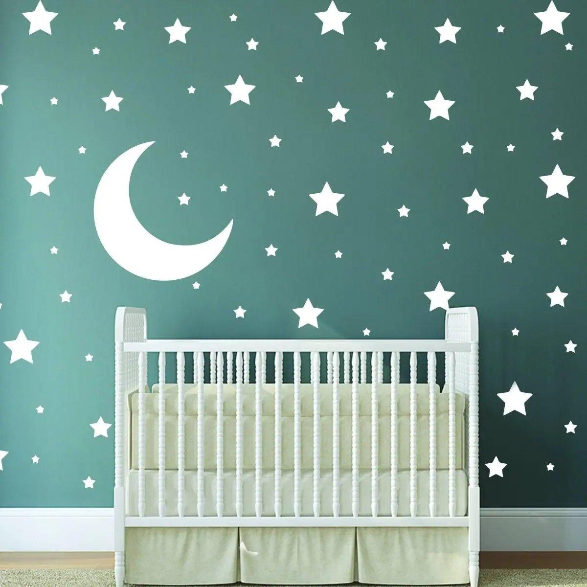 Celestial Dreams Wall Decals featuring white stars and a moon in a nursery setting, creating a magical atmosphere.