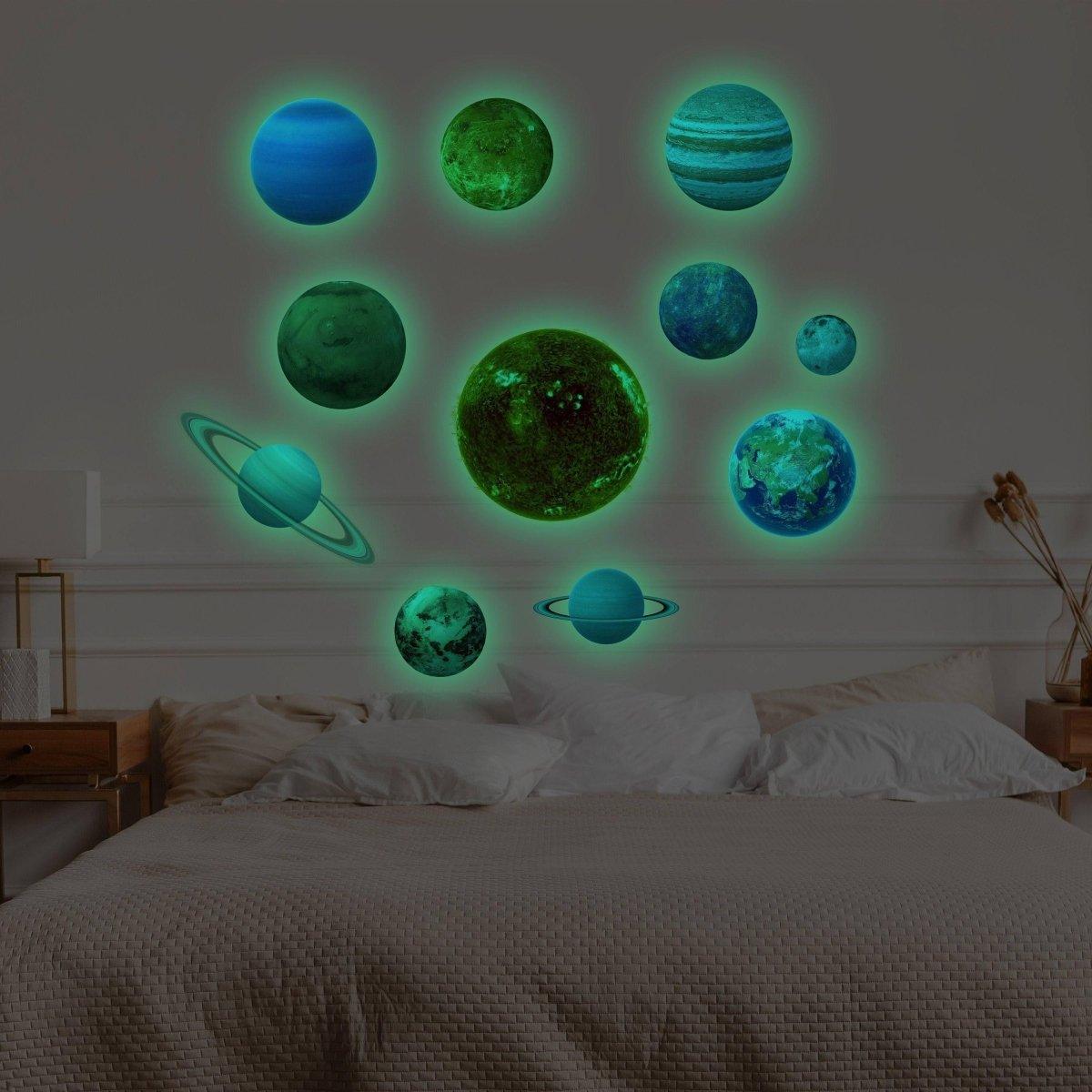 Glow in the dark solar system wall stickers on bedroom wall, featuring planets and stars for celestial decor.