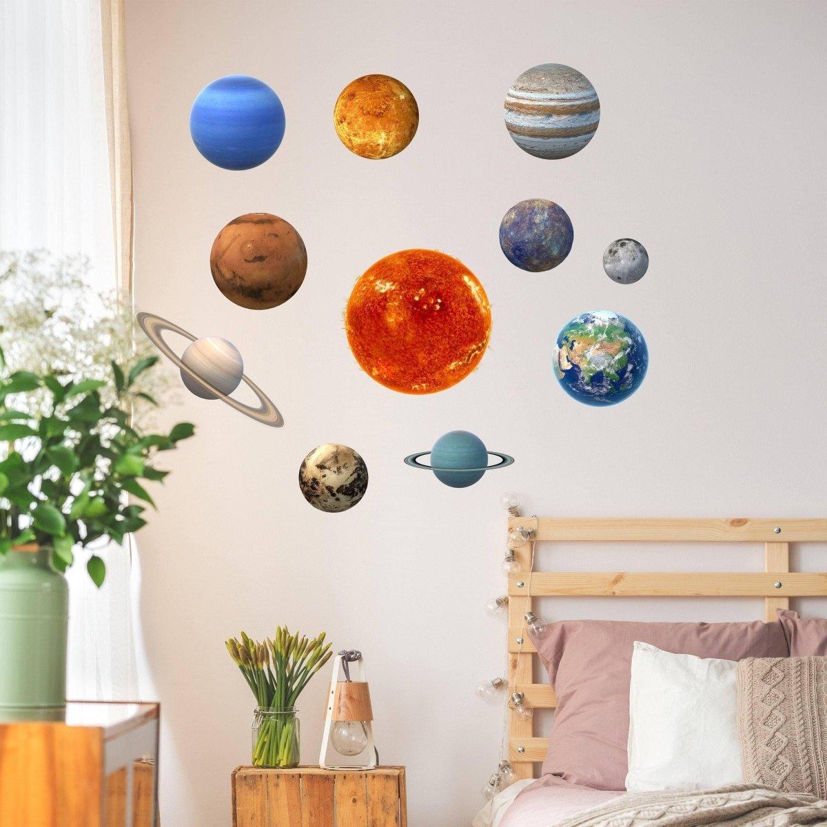 Glow in the dark solar system wall stickers featuring planets and sun on a bedroom wall.