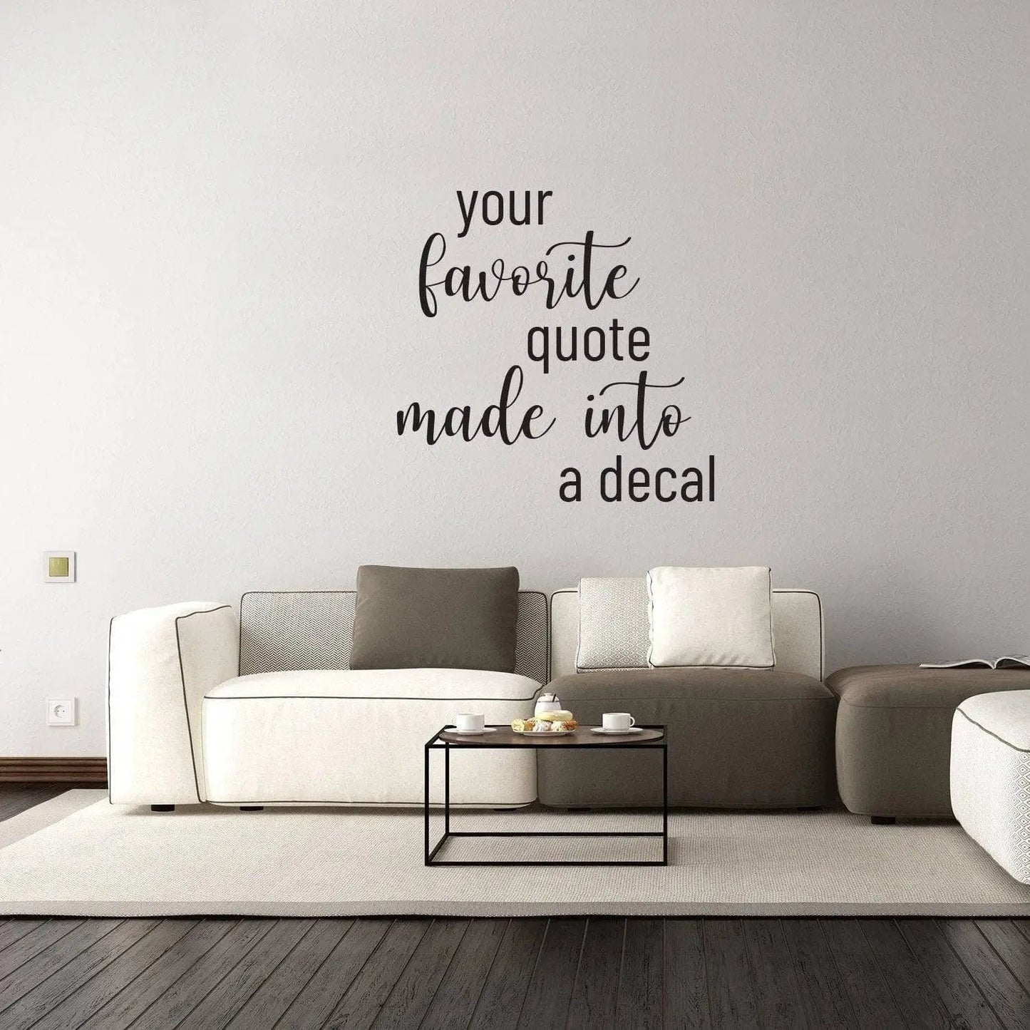 Customized vinyl wall decal of favorite quote above a modern living room couch.
