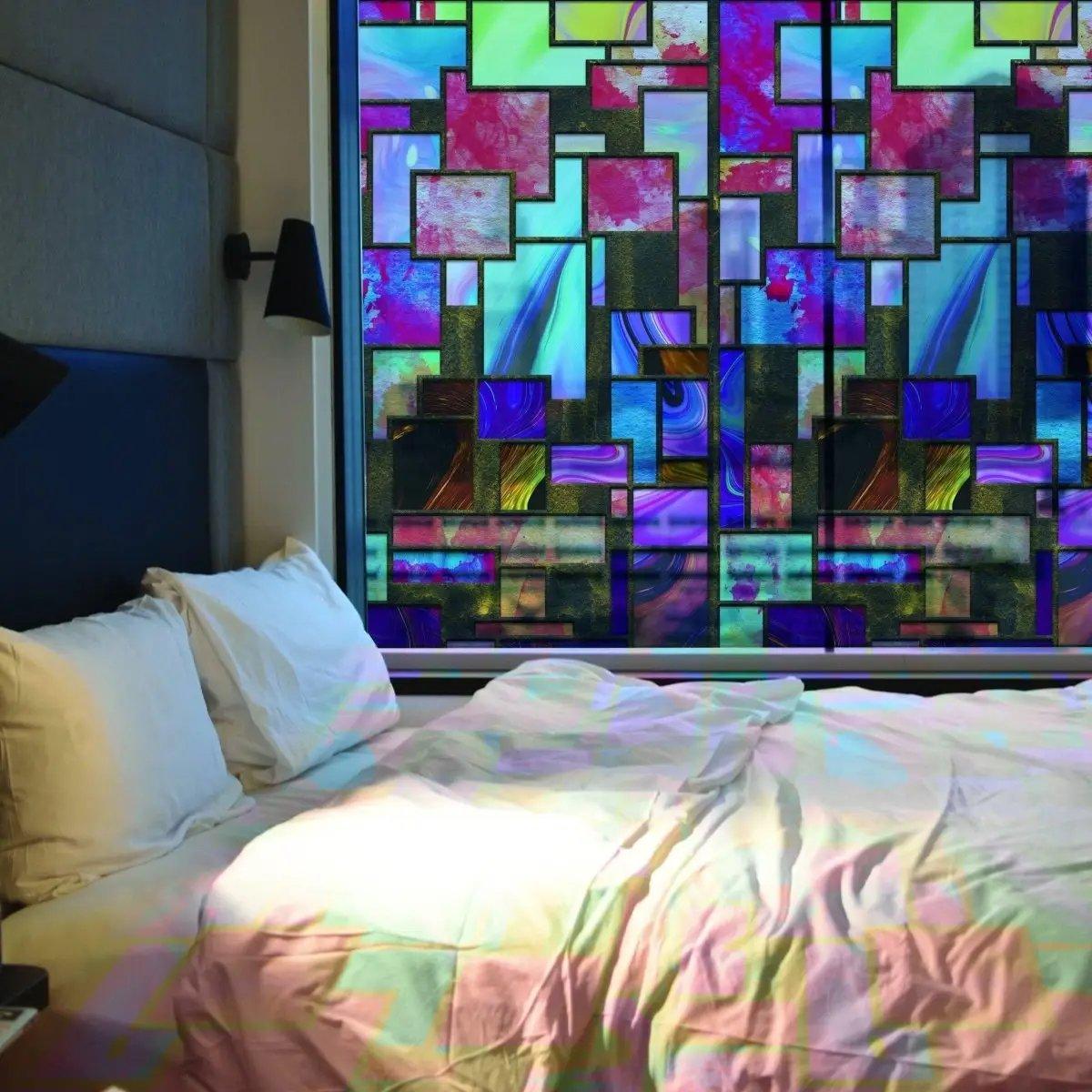 Colorful frosted window film in a modern bedroom, enhancing privacy while allowing natural light.