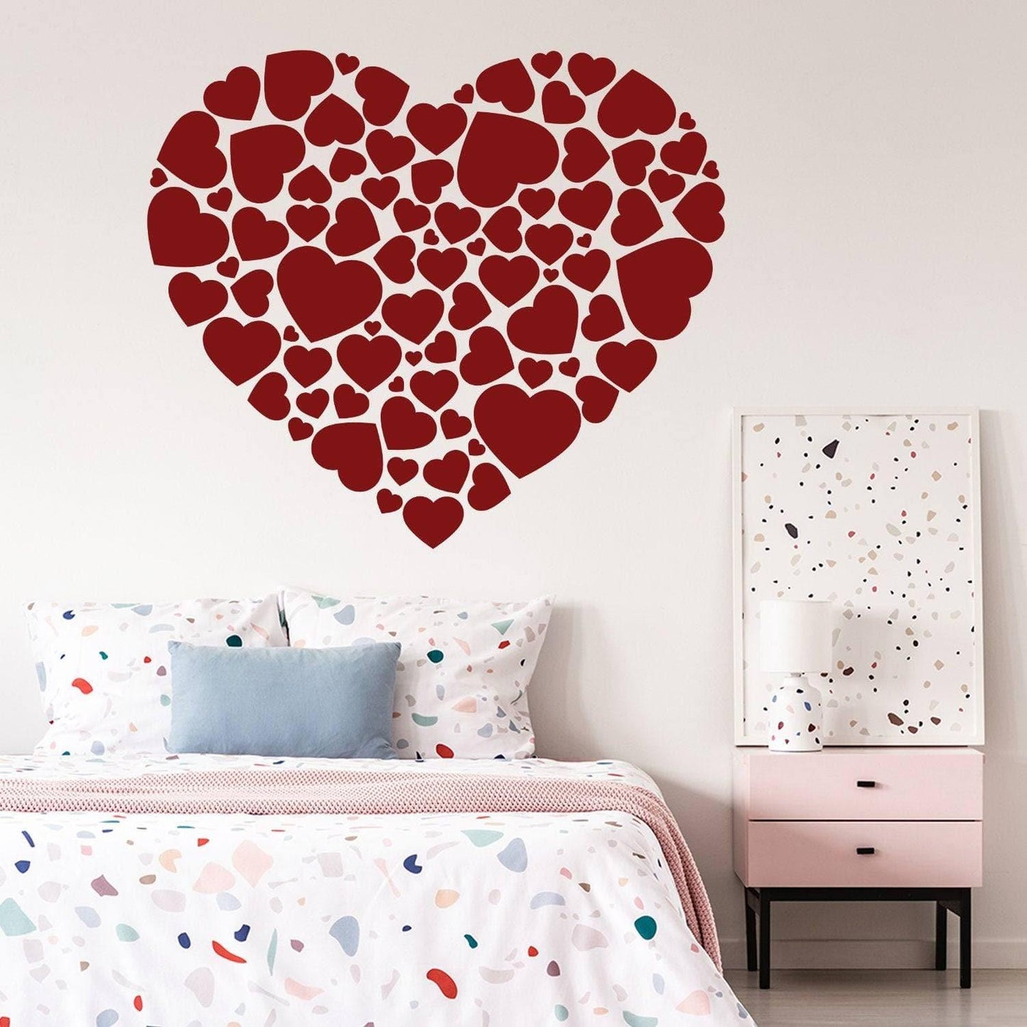 Red heart-shaped vinyl sticker collage on a wall, perfect for adding a romantic touch to any bedroom decor.