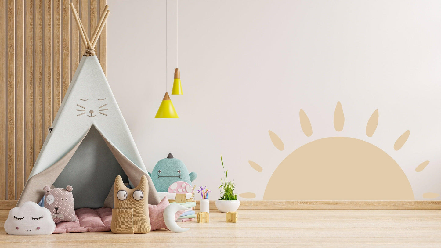 Colorful children's play area featuring a Boho sun wall decal, teepee, and plush toys for a whimsical decor.