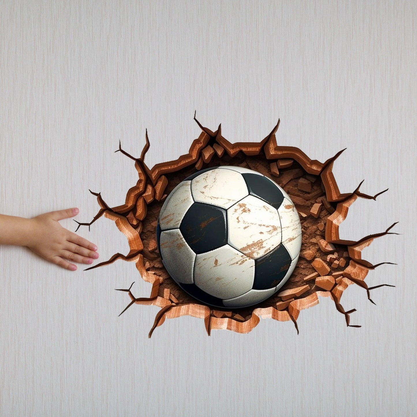 3D football wall decal with realistic soccer ball bursting through the wall, perfect for boys' rooms and play areas.