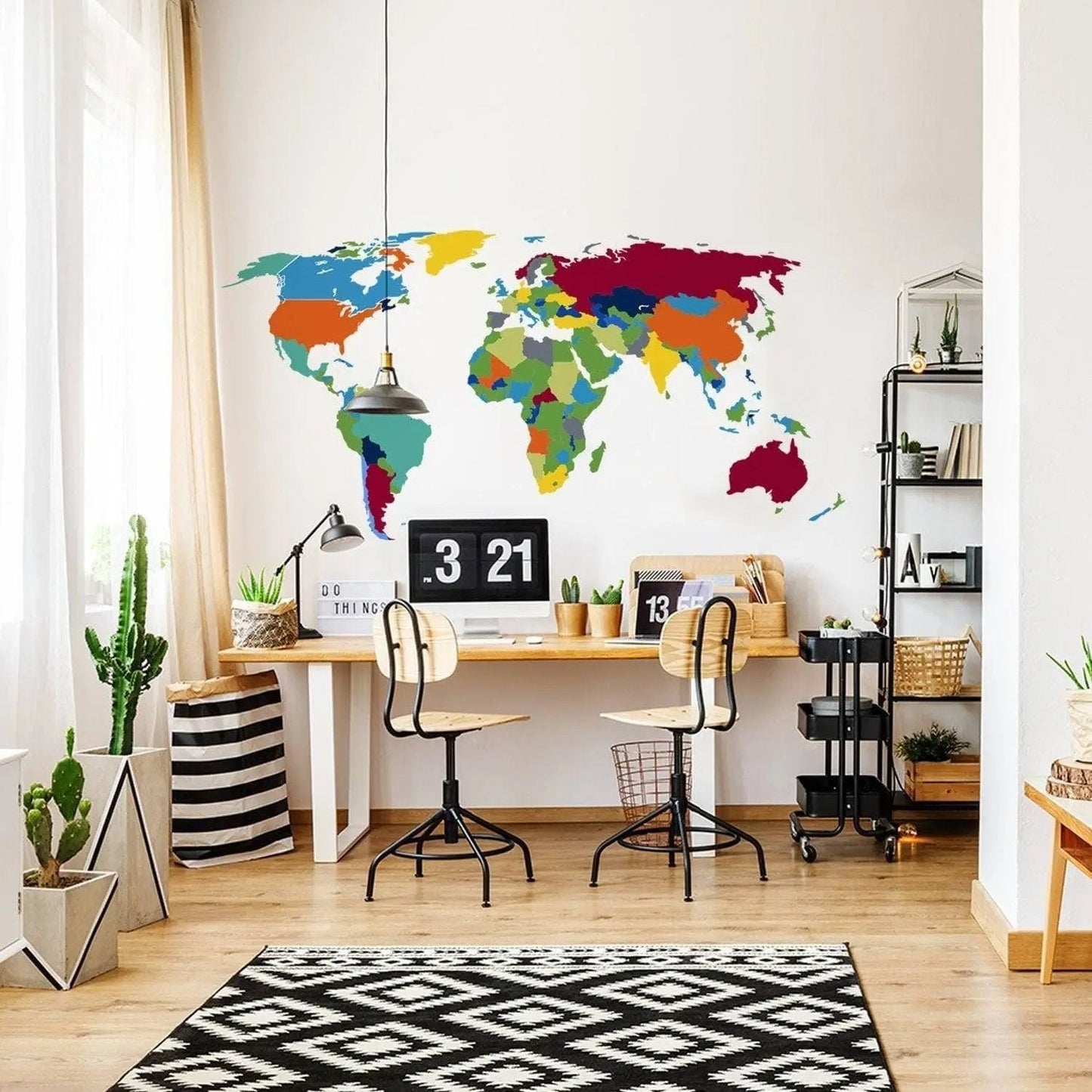 Vibrant world map wall sticker in modern workspace with desk and plants, ideal for geography lovers and decor.