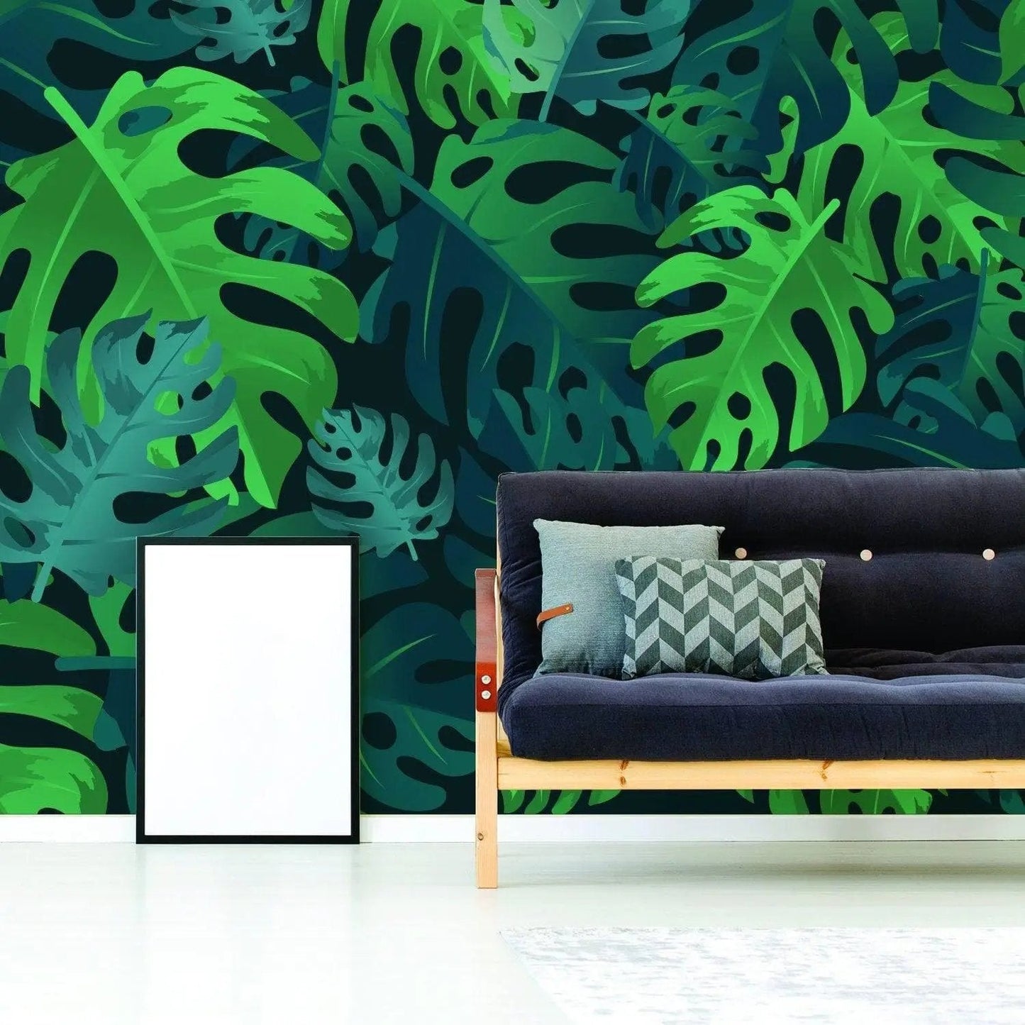Tropical Paradise Peel and Stick Wallpaper featuring lush green leaves in a stylish living room with a modern couch.