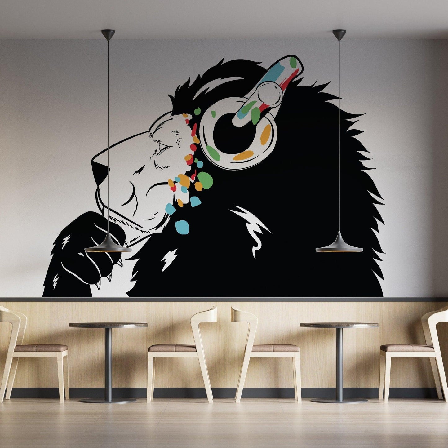 Contemporary lion DJ wall decal featuring colorful headphones, perfect for adding personality to any space.
