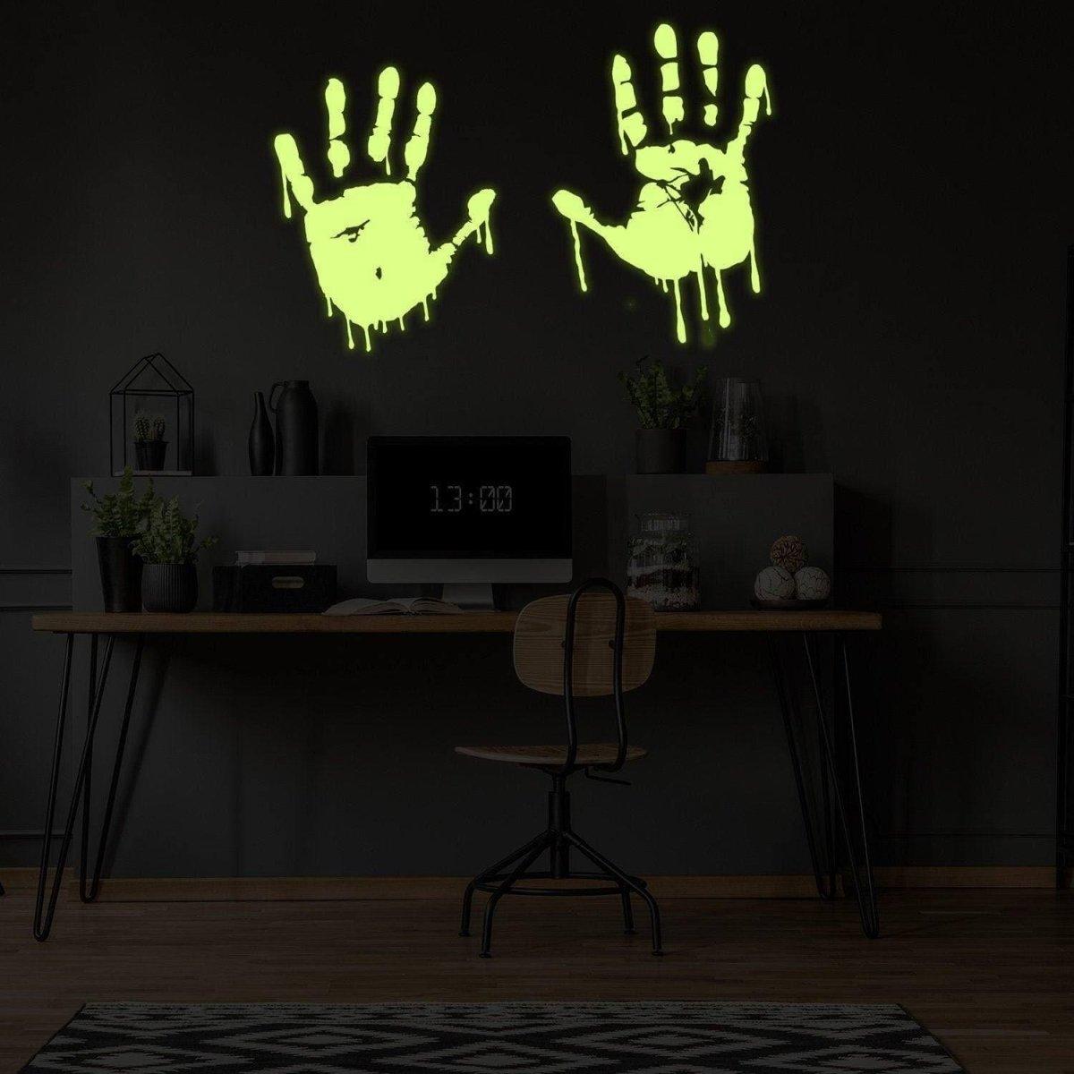 Glowing zombie blood wall decal featuring luminous bloody hands in a dark room, perfect for spooky decor.