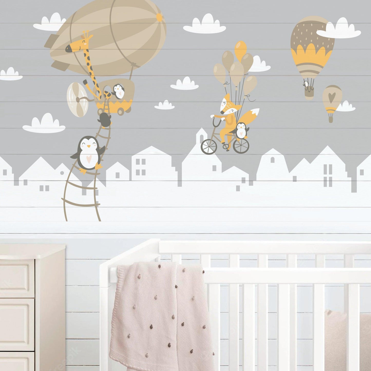 WhimsyLand wall decals featuring penguins, fox, and hot air balloons in a nursery setting.