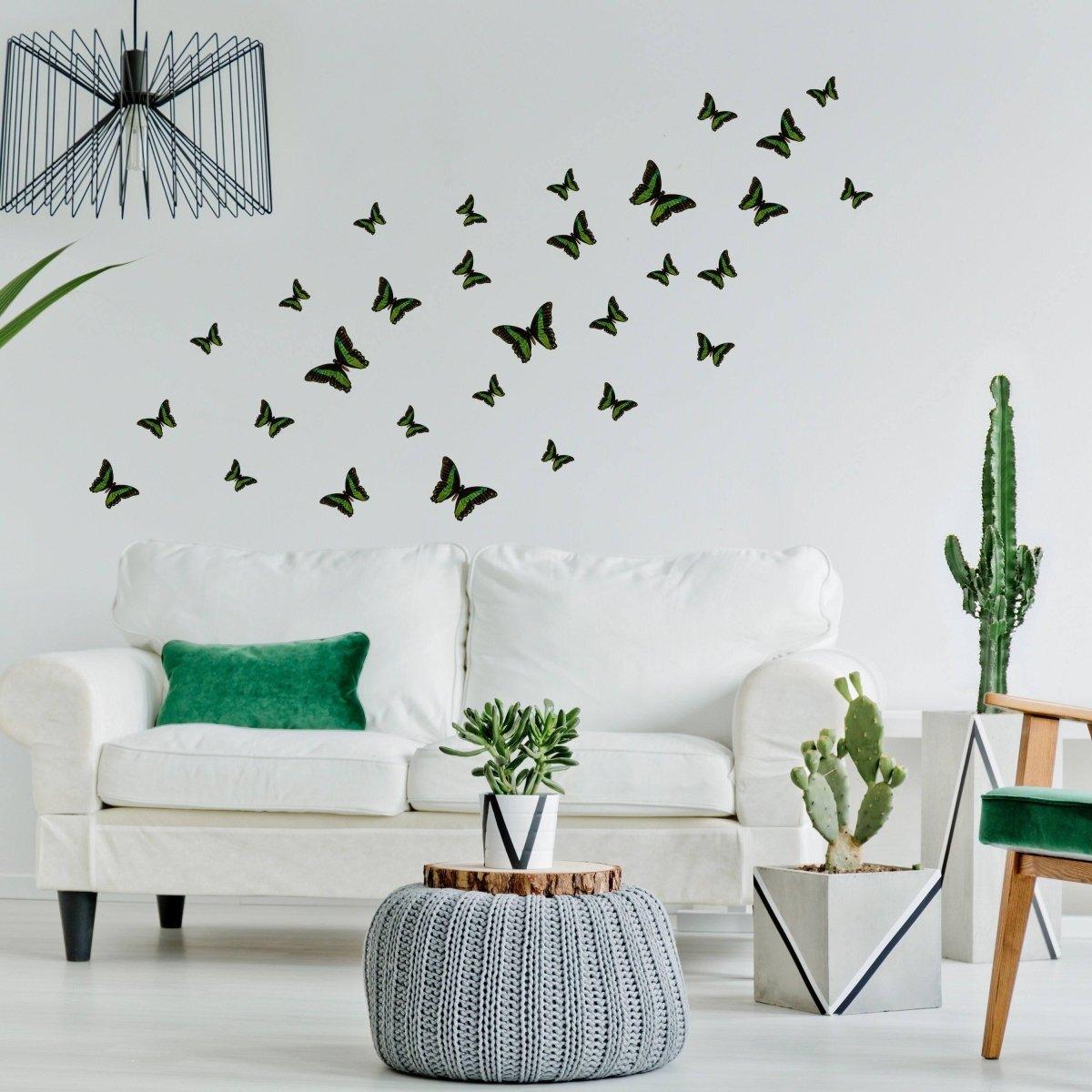 Decorative butterflies on a wall above a cozy sofa in a stylish living room, adding a whimsical touch to the decor.