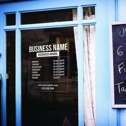 Personalized vinyl business hours decal displayed on a storefront window.