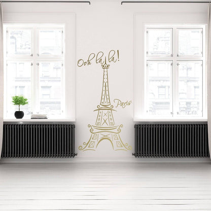 Eiffel Tower vinyl decal in a bright indoor setting, adding a Parisian touch with 'Ooh la la! Paris' text.