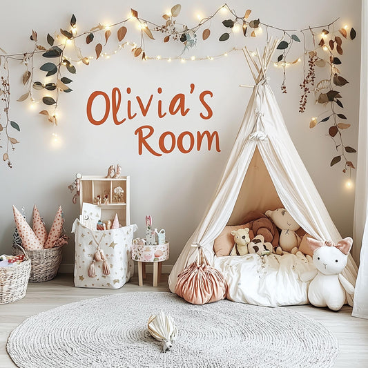 Personalized wall decal reading 'Olivia's Room' in a cozy kids' playroom with a teepee and soft toys.