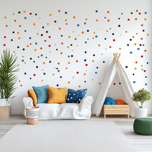 Colorful polka dot wall decals in a playful kids room with white couch and teepee, bright cushions, and greenery.