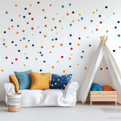Colorful polka dot wall decals in a playful kids room with a cozy white sofa and a teepee tent.