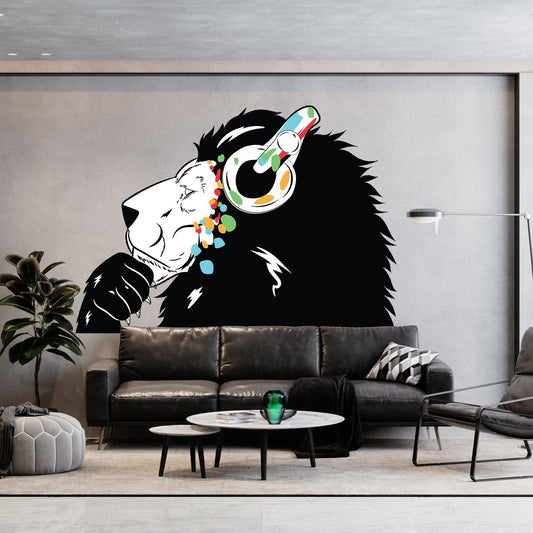 Contemporary lion DJ wall decal featuring colorful headphones on a sleek living room wall.